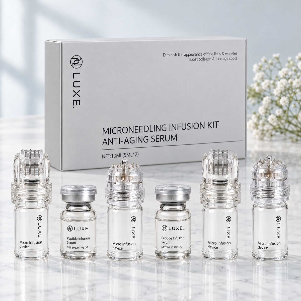LUXE Micro-Infusion Kit box with its six contents on a marble surface